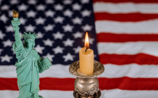 istock American flag for remembrance day the candle burns 1160880624