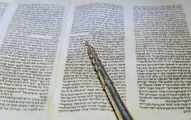 istock NEW YORK NY March 2019. Hebrew religious Torah old scroll book parchment 1160880630