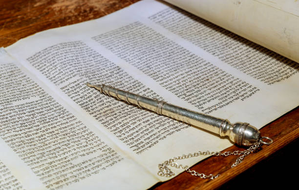 NEW YORK NY March 2019. The Hebrew Torah a synagogue Jewish holidays, during letters of old scroll book NEW YORK NY March 2019. The Hebrew Torah old scroll book on a synagogue Jewish holidays, during letters of scriptures close up. simchat torah photos stock pictures, royalty-free photos & images