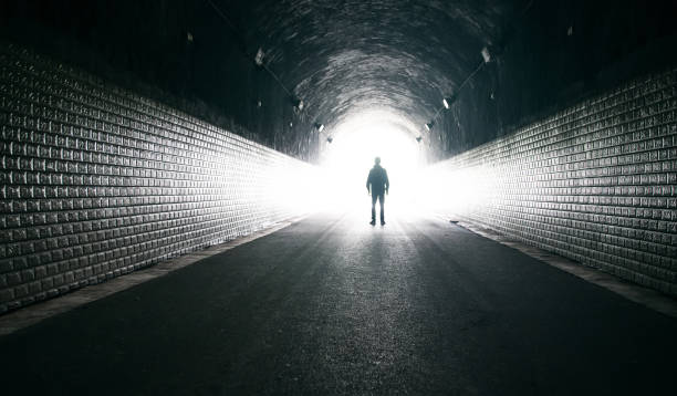 istock Dreaming,man in dark tunnel 1160883399