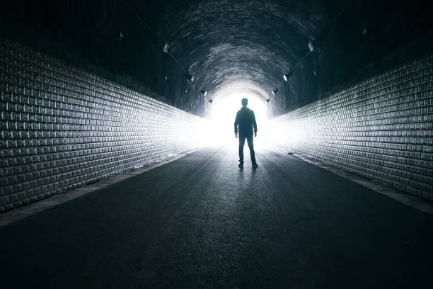 istock Dreaming,man in dark tunnel 1160883403