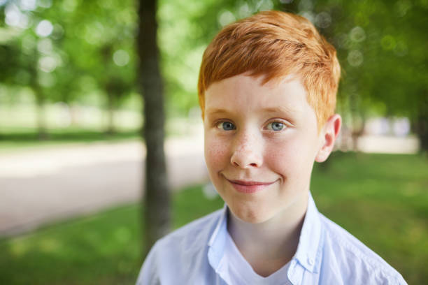 istock Cute redhead boy in park 1160883606