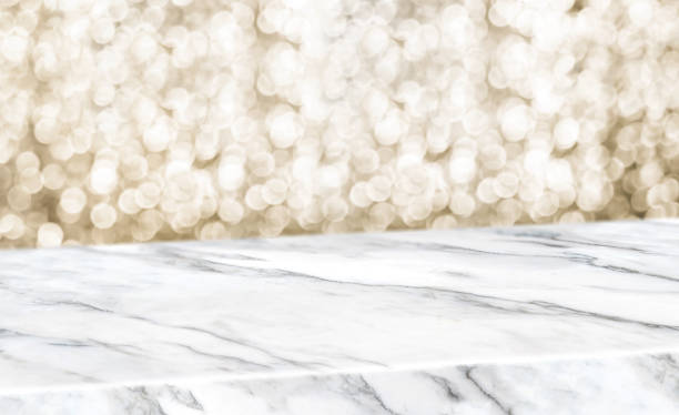 istock white marble glossy table diagonal with blur sparkling gold bokeh abstract background,panoramic banner for display or montage of product,Holiday seasonal concept backdrop. 1160886512