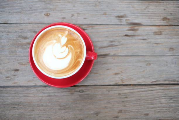 istock Closeup latte art coffee red cups in a cafe 1160886639