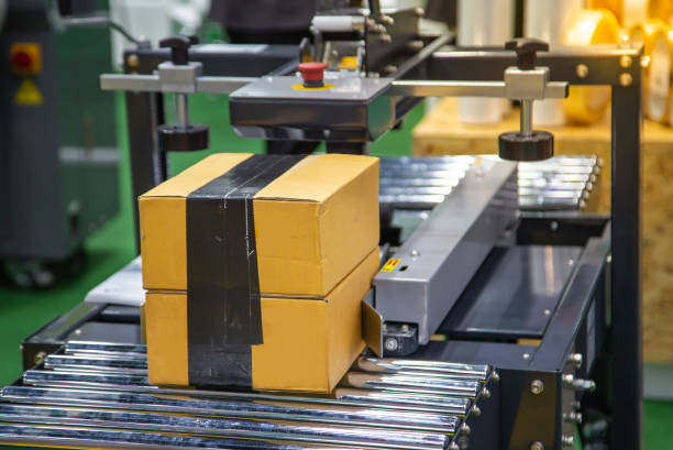 istock Cardboard box tape sealing machine 1160886671