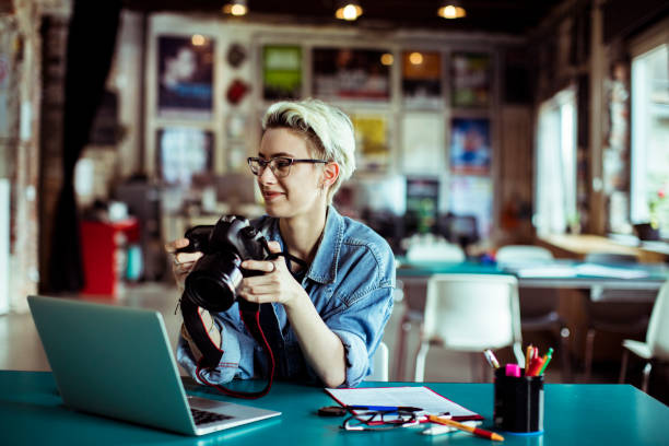 istock Female Photographer 1160888151