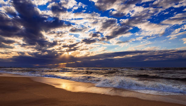 istock Colorful seashore with sand and beautiful clouds 1160889428