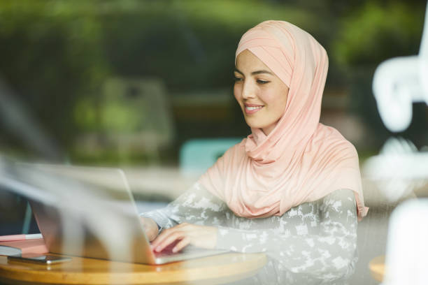 istock Muslim woman answering e-mails 1160893243