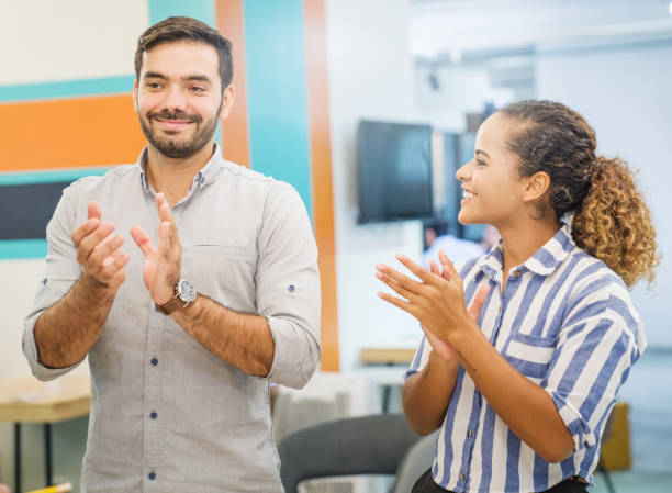 istock Group of young multiethnic diverse people gesture hand high five, laughing and smiling together in brainstorm meeting at office. Casual business with startup teamwork community celebration concept 1160894140