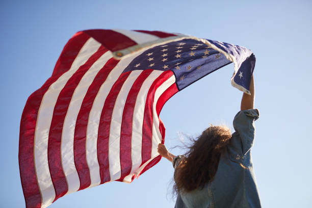 istock American flag flying in wind 1160894348
