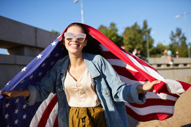istock Ecstatic woman having fun on independence day 1160894357
