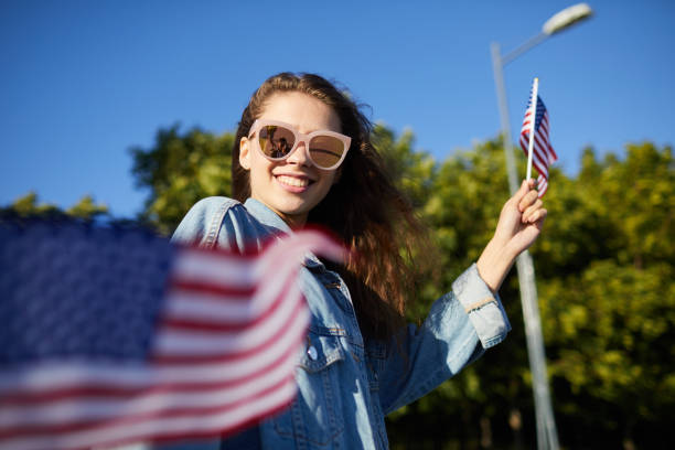 istock Girl strolling at national independence day parade 1160894389