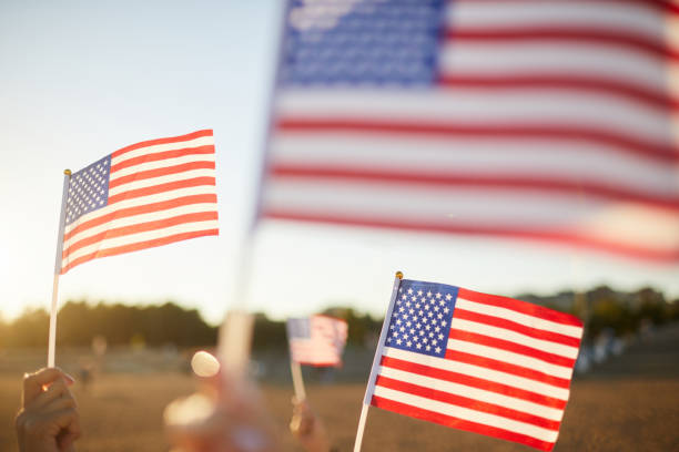 istock Waving American flags at parade 1160894411
