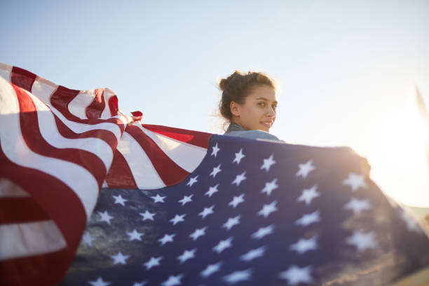 istock Pretty woman with waving flag 1160894415