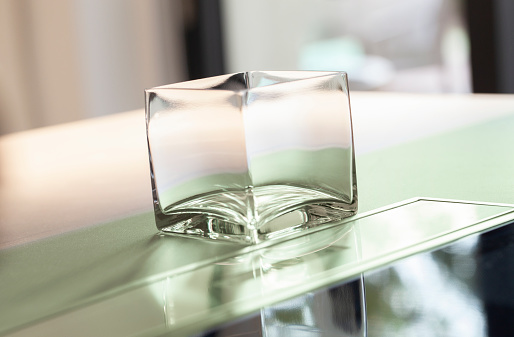 Small clear cube glass vase.