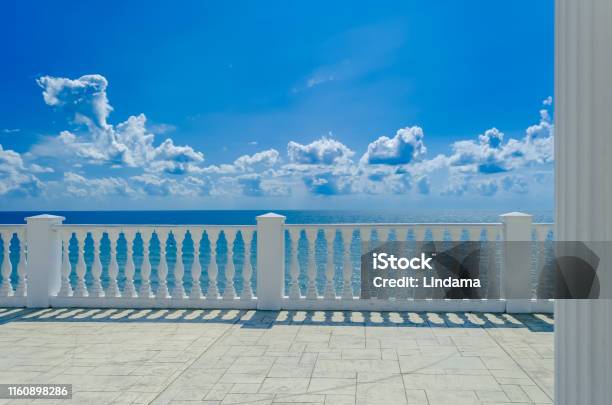 Terrace With White Balusters To Amazing Views Of The Sea Sky And White Clouds Stock Photo - Download Image Now