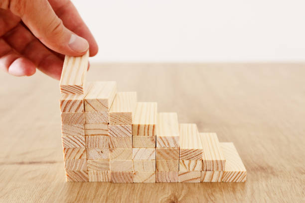 istock Business image of arranging wood blocks stacking as step stairs. Success and development concept 1160898556