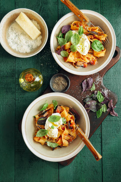 istock Pappardelle with eggplant, creamy tomato sauce and mozzarella 1160899623