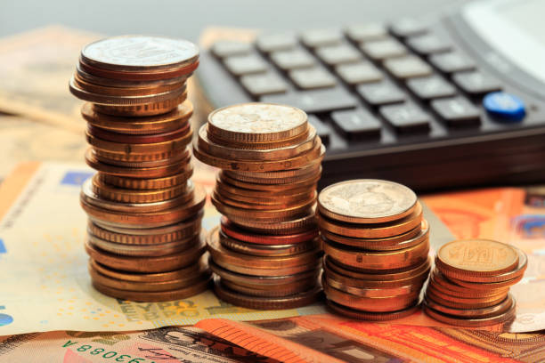 istock Financial business concept combination with coins, money, calculator and pen - Image 1160900607