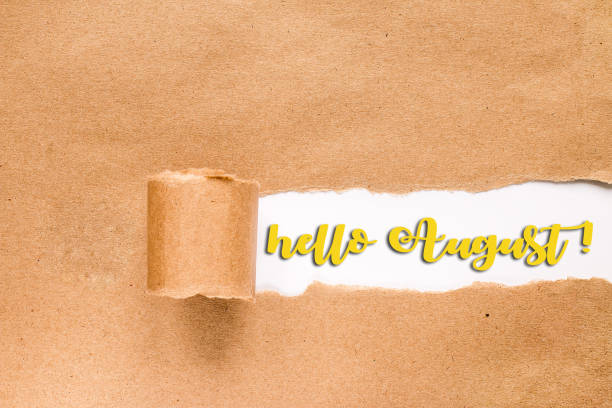 istock HELLO AUGUST lettering card. Inscription in torn envelope. 1160902766