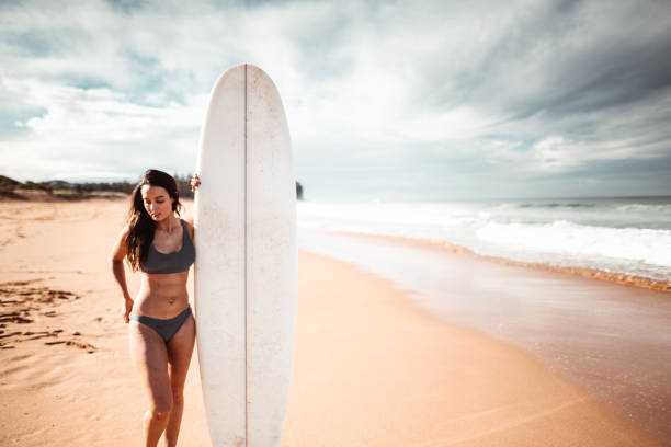 istock woman resting on the surf board in australia 1160904246