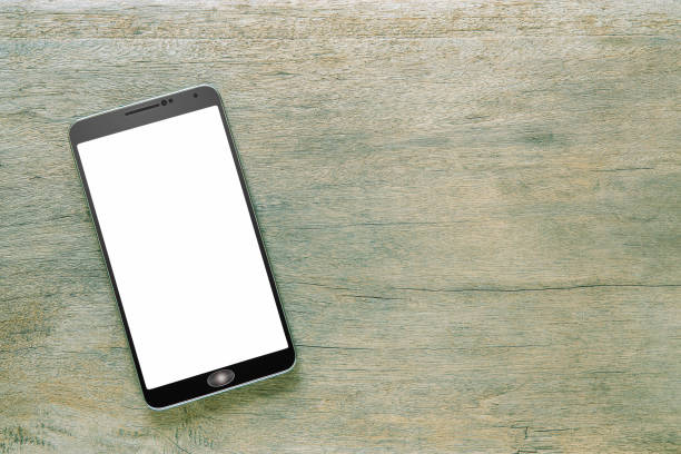 istock Smartphone with white screen on vintage grunge wooden background 1160905459