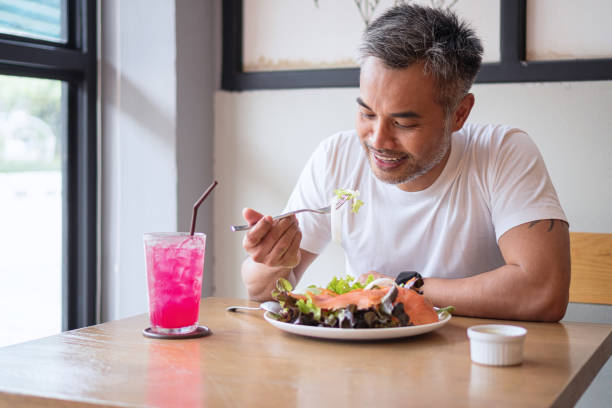 istock Young happy man enjoying in a healthy meal 1160906913