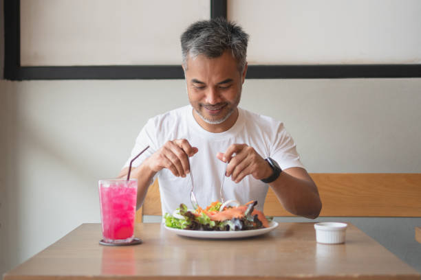 istock Young happy man enjoying in a healthy meal 1160906914