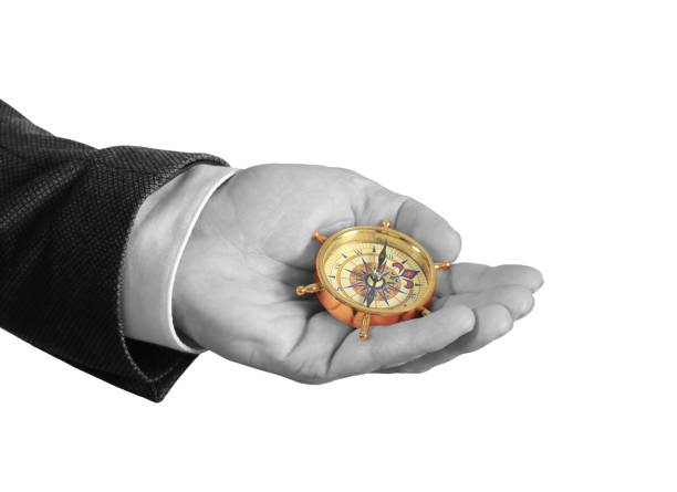istock Businessman with a compass holding in hand 1160907885