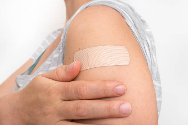 istock Woman with adhesive bandage on her shoulder 1160907953