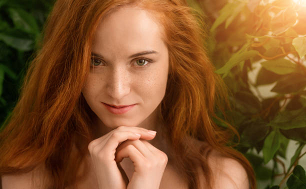 istock Sensual nude redhead woman looking at camera 1160908841