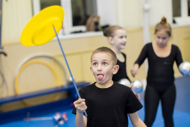 Little boy learn circus art.Child learn to juggle