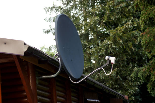 istock Satellite dish on wooden bungalow 1160911485