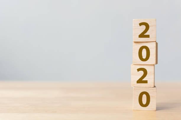istock New year resolution 2020 concept. Wooden block cube with year number on table 1160911510