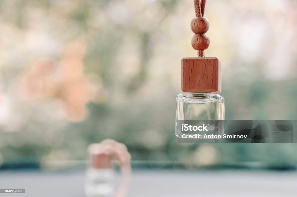 Small Glass Bottle With Car Perfume Hanging In The Car Beautiful