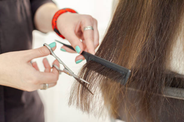 istock Woman does a haircut 1160913698