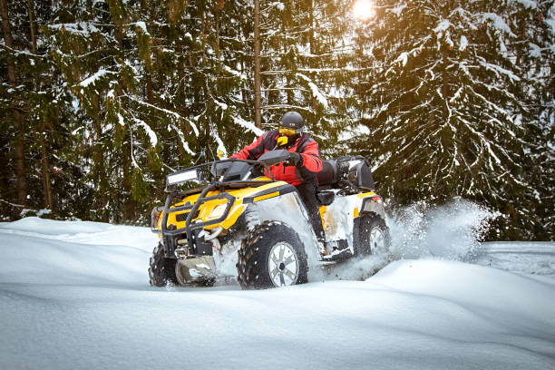 istock Winter race on an ATV on snow in the forest. 1160913726