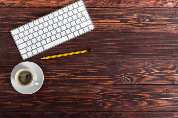 istock working place at wooden desktop with coffee 1160913762