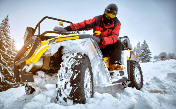 istock Winter race on an ATV on snow in the forest. 1160913848
