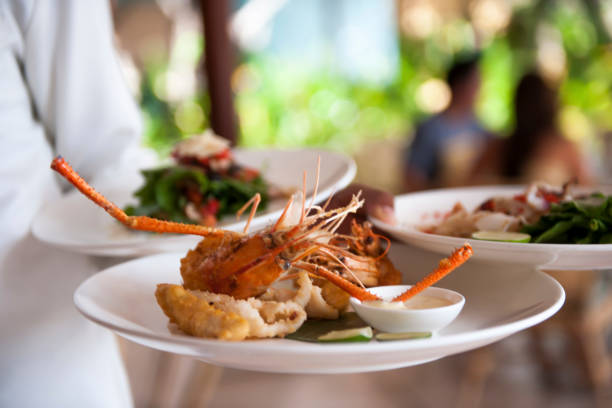 istock Waiter serving plates with food at the restaurant 1160913933