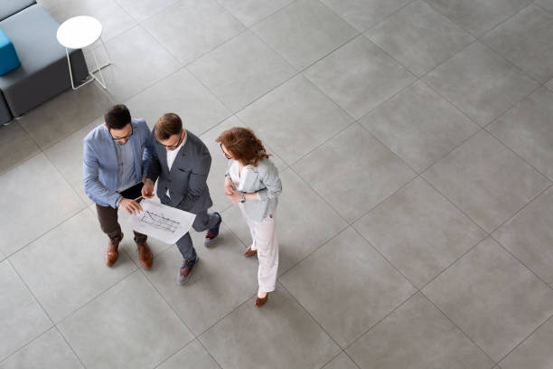 istock Business people planning strategy in office together 1160914241