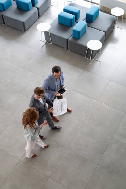 istock Group of architects and business people working together 1160914263
