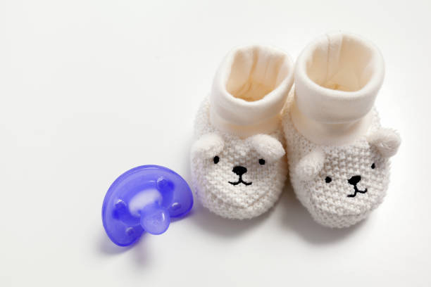 istock Baby shoes isolated on the white background 1160915184