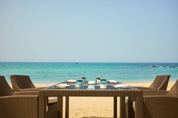 istock tropical restaurant on the beach with view over turquoise ocean 1160915922