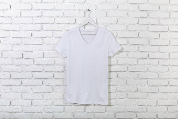 istock brick whitewashed wall with t-shirt on hanger 1160916816