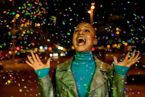 istock Cool woman under a rain of confetti 1160922294