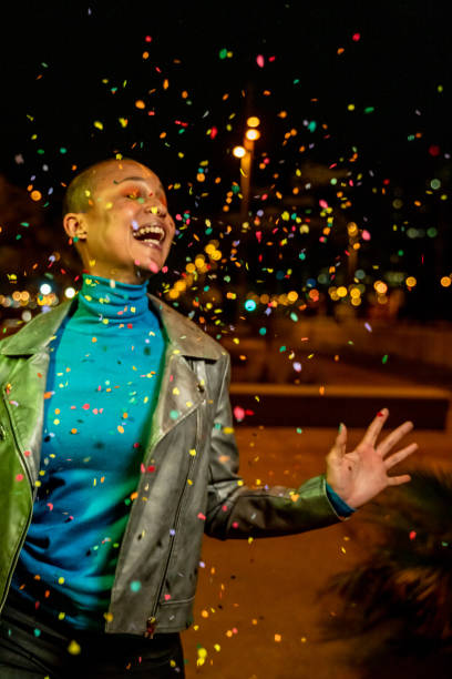 istock Cool woman under a rain of confetti 1160922315