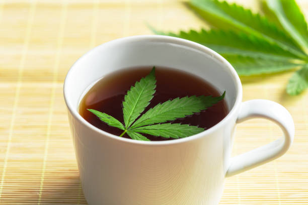 istock Cannabis herbal tea and marijuana leaves 1160922348