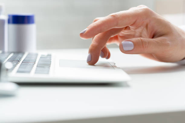 istock Female doctor is typing in laptop computer 1160924269