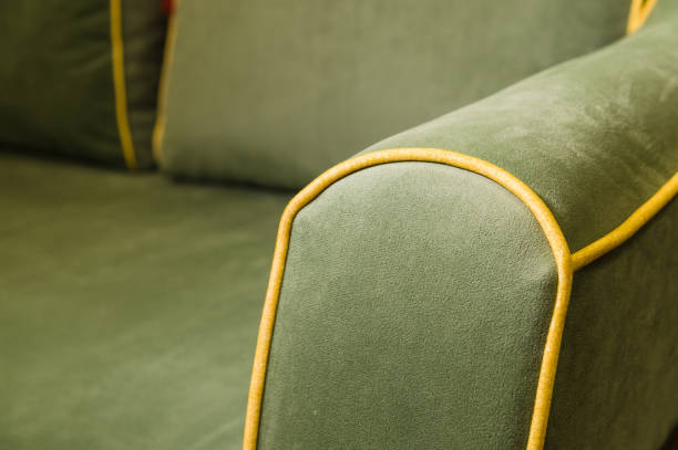 Close-up green corner sofa with armrest. Close-up green corner sofa with armrest. Textile new furniture modern design. couch arm rest stock pictures, royalty-free photos & images